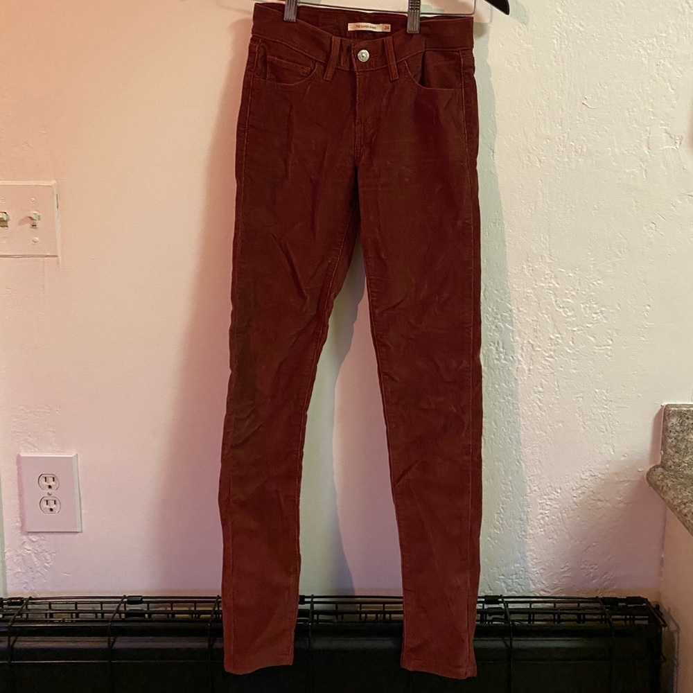 Levi’s maroon skinny corduroy pants.